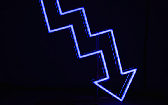 Downward arrow outlined in blue neon lights