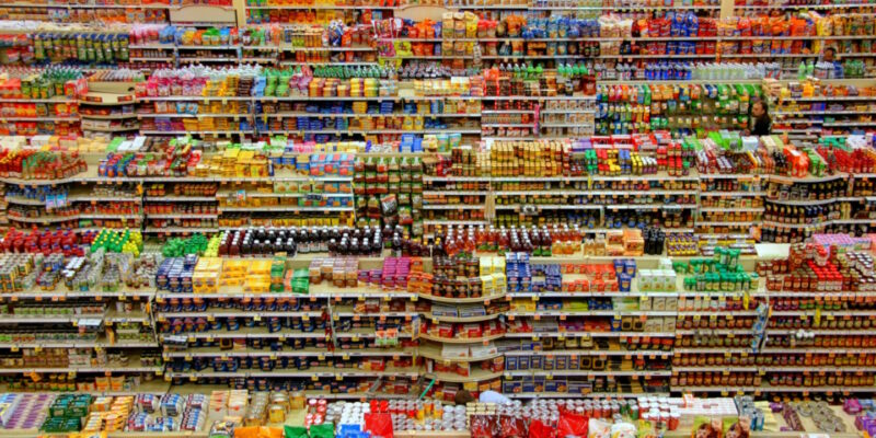 Several aisles in a supermarket seen from above and over-diversified merchandise